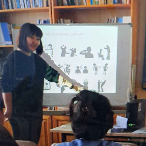 Leaders of the Culture Centre for the Deaf, Mongolia presenting information to deaf participants.