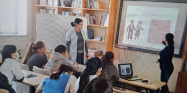 Leaders of the Culture Centre for the Deaf, Mongolia presenting information to deaf participants.